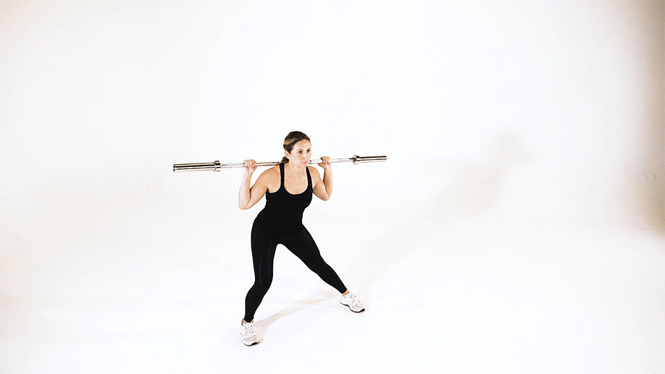 Zancada lateral con barra